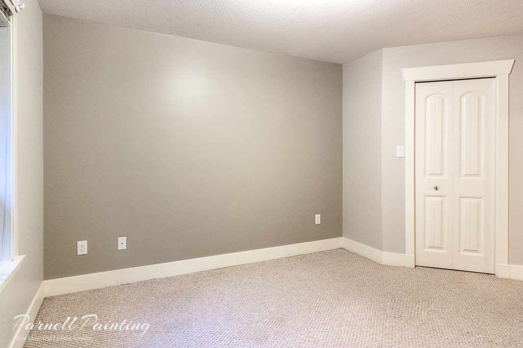 darker grey accent wall with lighter grey walls