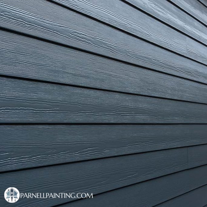 a james harding board house with a satin paint that highlights the texture of the horizontal siding